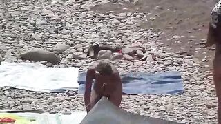Nudist couple enjoys romantic sex on the beach