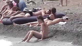 Nudist couple enjoys romantic sex on the beach