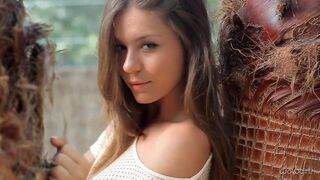 A young Russian girl is stripping eroticly on her webcam