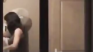 He looks at himself in the mirror completely naked
