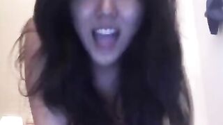 Asian girl masturbates on her bed and reaches intense pleasure