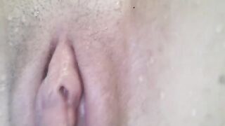 A hot girl plays with herself in the water and reaches orgasm