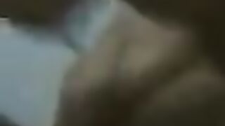 A fat woman is dancing naked in front of her husband