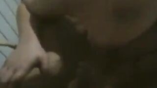 A fat woman is dancing naked in front of her husband