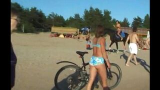 Nudists are having fun on the beach without any clothes