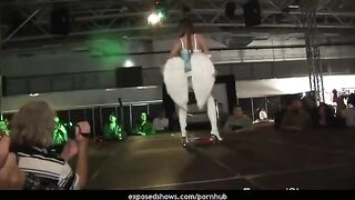 A hot brunette learns to work with a striptease pole and shows her skills
