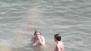 A group of naked girls are having bath in the sea