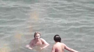 A group of naked girls are having bath in the sea