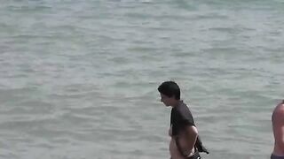 A group of naked girls are having bath in the sea