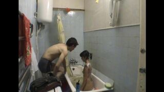 A girl has sex with her brother in the bathroom, captured in a steamy image