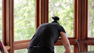 Sexy Vietnamese girl fucked with a strapon in the kitchen