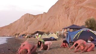 A volleyball game with a naked beauty on the beach