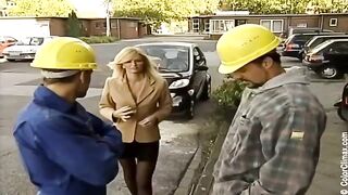 Girl in black pantyhose gets fucked on the set of porn, showcasing suspender tights action