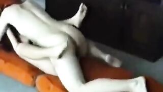 A married couple have sex at their home, showcasing passionate homemade moments
