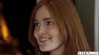 The guy carefully licked the red hair of the girl