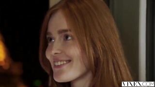 The guy carefully licked the red hair of the girl