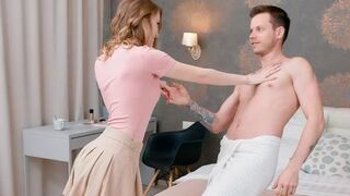 Two lovers have a conversation while lying on the bed completely naked