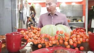 Fella stuffed cherry pie with his wife in the kitchen