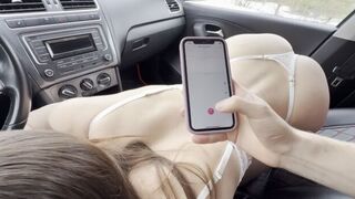 A girl has sex with her stepbrother in the car, using a phone stand