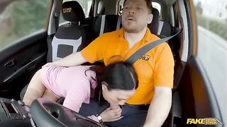 The girl is trying to seduce a guy in the car