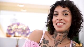 A girl is having fun with a guy and sex toys on the couch