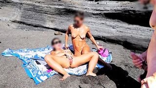 A girl shows her body on the nude beach to excite a man