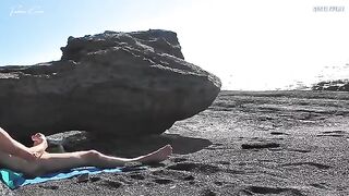 A girl shows her body on the nude beach to excite a man