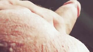 The man's hand glides along and strokes the barrel