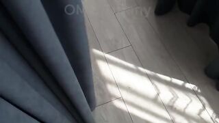A cute 18-year-old girl is rolling on a bed sheet like a storm
