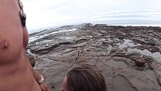 The girl is not ashamed to have sex on the beach and masturbate publicly