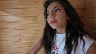 A stunning brunette gets undressed and ready for intense action in sauna