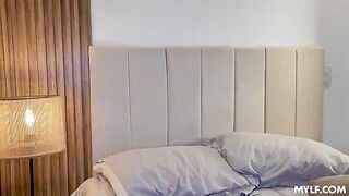 A blonde in cowgirl pose on the bed, 2026