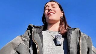 A petite babe masturbates outdoors on a mini skirt risking getting caught