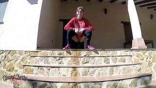 A girl with a full bladder walks outside and urinates, showcasing Megan Rain’s petite frame